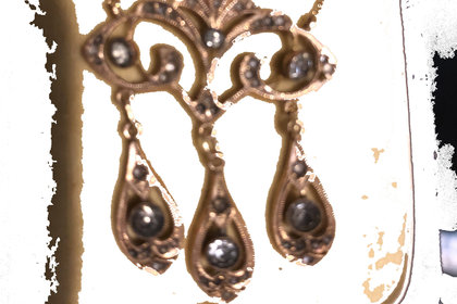 An old golden jewel with black gemstone ornaments